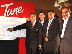 2nd right in picture: YM Tengku Aziz when he was the CEO of Tune Money, a company related to the AirAAsia outfit, (after the then Minister of Finance II Tan Sri Nor Mohamad Yakop)   